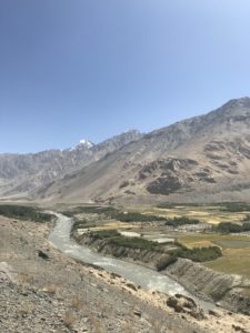 The road follows the river. On the other side is Afghanistan.